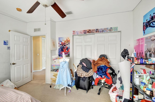 bedroom featuring ceiling fan, visible vents, a closet, and carpet floors
