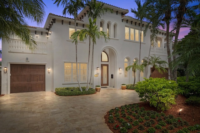 mediterranean / spanish-style house featuring a garage