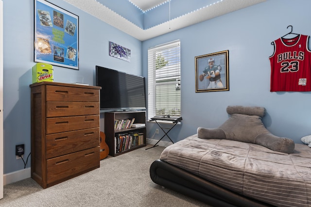 bedroom featuring light carpet