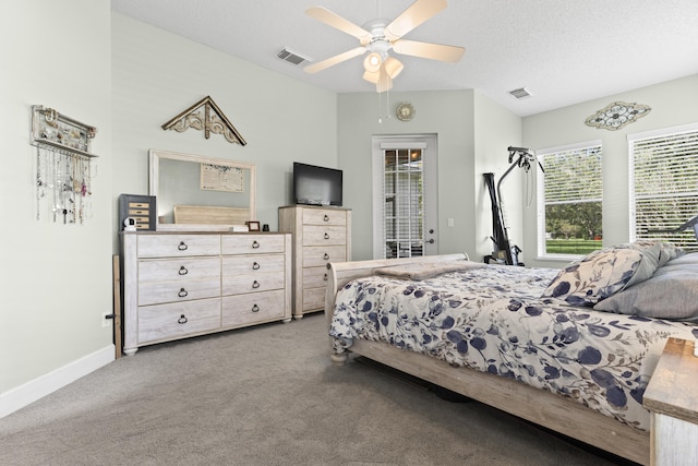 carpeted bedroom with ceiling fan, access to outside, and a textured ceiling