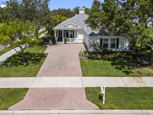 view of front of house featuring a front yard and a porch