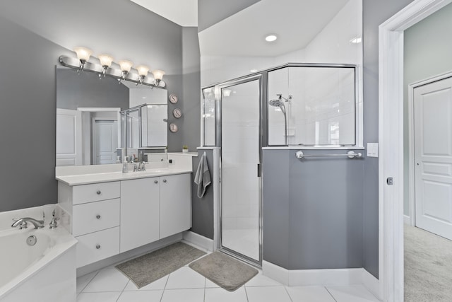 bathroom featuring shower with separate bathtub, tile patterned flooring, and vanity