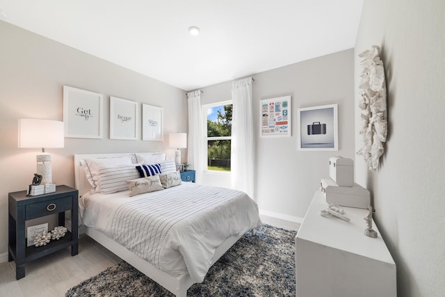 bedroom with light hardwood / wood-style floors