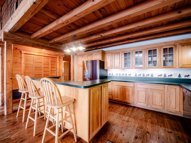 kitchen featuring a kitchen island, high end fridge, beamed ceiling, hardwood / wood-style flooring, and wooden ceiling