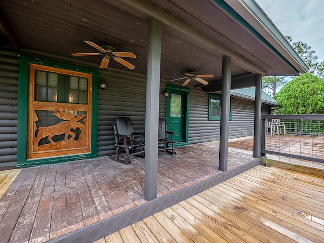 wooden deck featuring ceiling fan