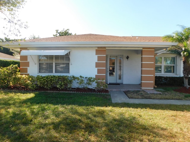 view of front of home with a front yard