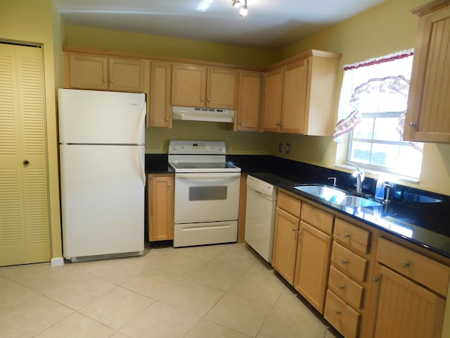 kitchen with sink, light tile patterned flooring, and white appliances