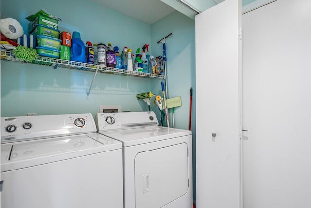 laundry room featuring separate washer and dryer