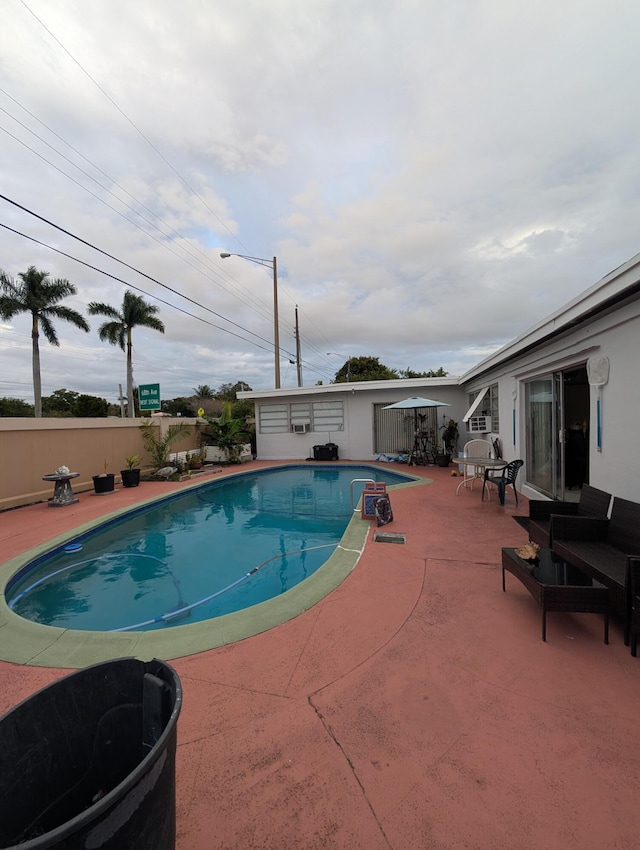 view of swimming pool featuring a patio area