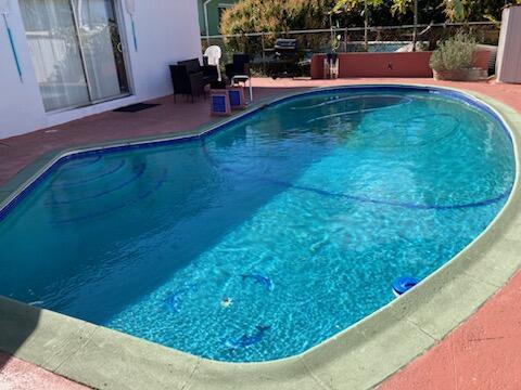 view of swimming pool featuring a patio