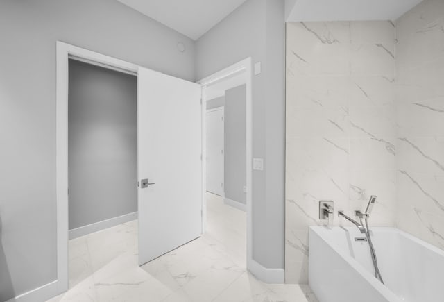 3100 N Ocean Dr Unit H-1508, Singer Island, FL 33404 - bathroom with a bath and marble finish floors