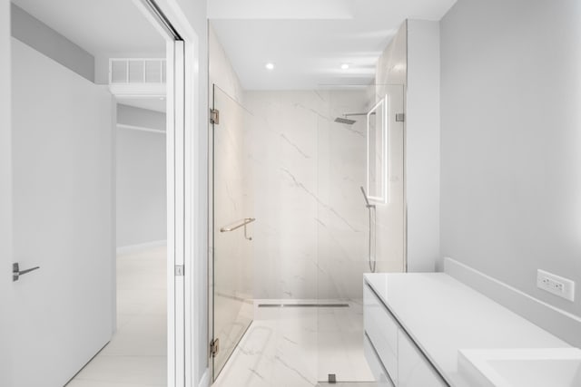 3100 N Ocean Dr Unit H-1508, Singer Island, FL 33404 - bathroom featuring a marble finish shower, marble finish floors, vanity, and recessed lighting
