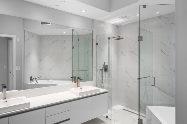 3100 N Ocean Dr Unit H-1508, Singer Island, FL 33404 - bathroom with double vanity, a marble finish shower, a soaking tub, marble finish flooring, and recessed lighting