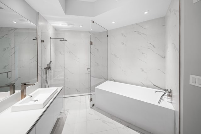 3100 N Ocean Dr Unit H-1508, Singer Island, FL 33404 - bathroom with a soaking tub, marble tiled flooring, vanity, recessed lighting, and a marble finish shower