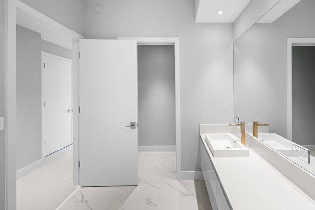 3100 N Ocean Dr Unit H-1508, Singer Island, FL 33404 - bathroom featuring marble finish flooring, baseboards, vanity, and recessed lighting