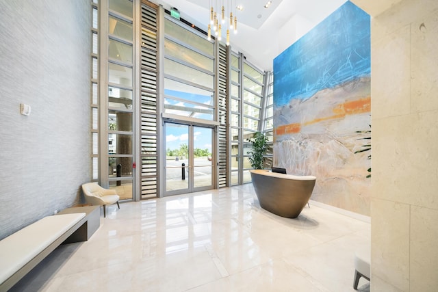 3100 N Ocean Dr Unit H-1508, Singer Island, FL 33404 - common area with a high ceiling and expansive windows