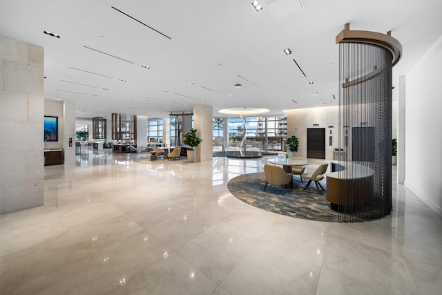 3100 N Ocean Dr Unit H-1508, Singer Island, FL 33404 - building lobby featuring a wall of windows