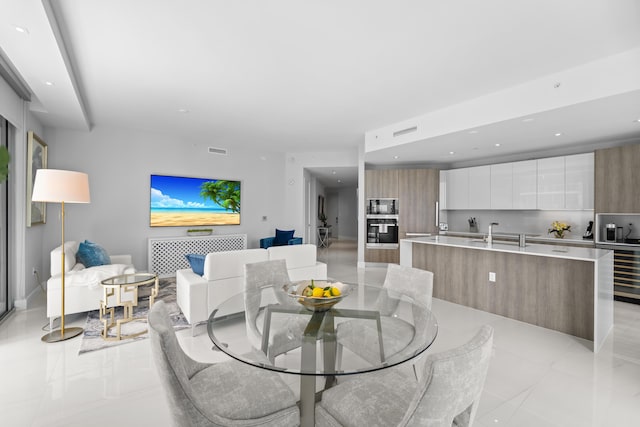 3100 N Ocean Dr Unit H-1508, Singer Island, FL 33404 - dining room featuring beverage cooler and recessed lighting