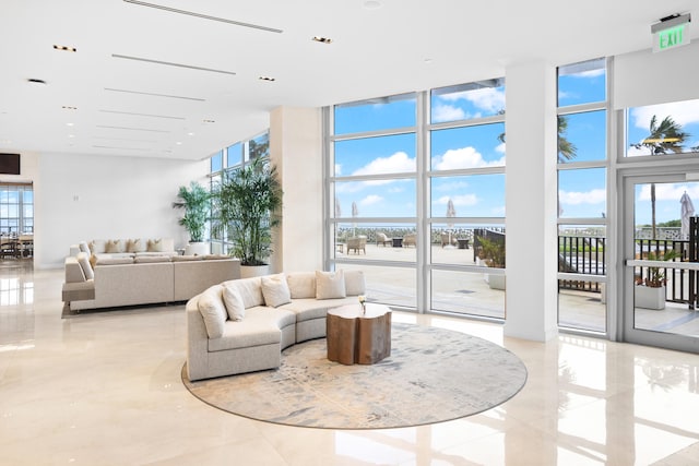 3100 N Ocean Dr Unit H-1508, Singer Island, FL 33404 - community lobby featuring a high ceiling and floor to ceiling windows