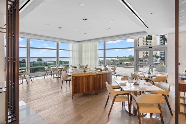 3100 N Ocean Dr Unit H-1508, Singer Island, FL 33404 - dining room with floor to ceiling windows, light wood-style flooring, and french doors