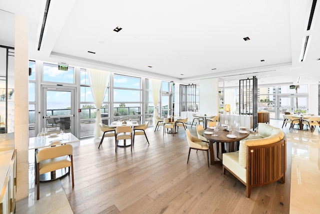 3100 N Ocean Dr Unit H-1508, Singer Island, FL 33404 - dining area featuring healthy amount of natural light, floor to ceiling windows, and light wood-type flooring