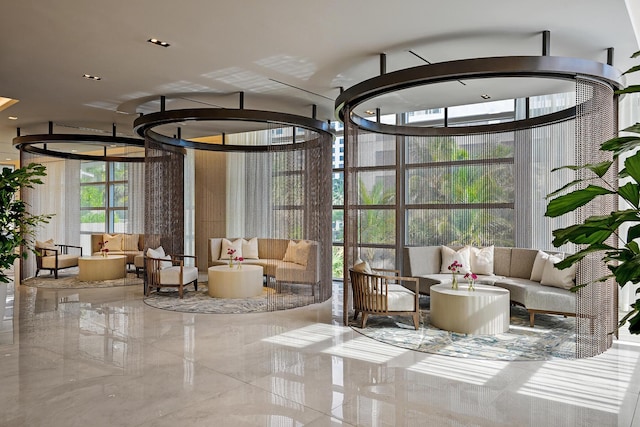3100 N Ocean Dr Unit H-1508, Singer Island, FL 33404 - building lobby featuring expansive windows and a high ceiling
