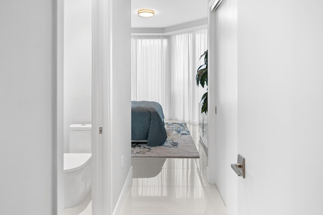 3100 N Ocean Dr Unit H-1508, Singer Island, FL 33404 - bathroom with toilet, tile patterned flooring, and baseboards