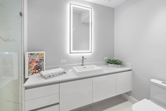 3100 N Ocean Dr Unit H-1508, Singer Island, FL 33404 - full bathroom with vanity, toilet, marble look tiles, and an enclosed shower