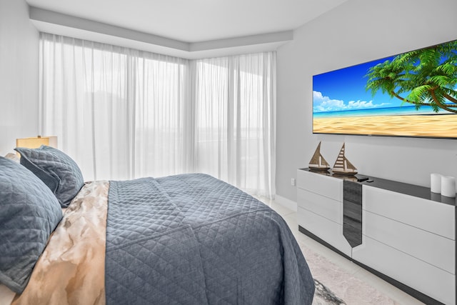 3100 N Ocean Dr Unit H-1508, Singer Island, FL 33404 - bedroom with multiple windows and light tile patterned flooring