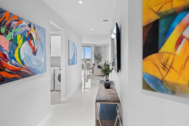 3100 N Ocean Dr Unit H-1508, Singer Island, FL 33404 - hallway with washer and clothes dryer, baseboards, light tile patterned floors, and recessed lighting