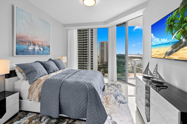 3100 N Ocean Dr Unit H-1508, Singer Island, FL 33404 - bedroom with floor to ceiling windows and tile patterned flooring