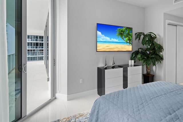 3100 N Ocean Dr Unit H-1508, Singer Island, FL 33404 - tiled bedroom featuring baseboards