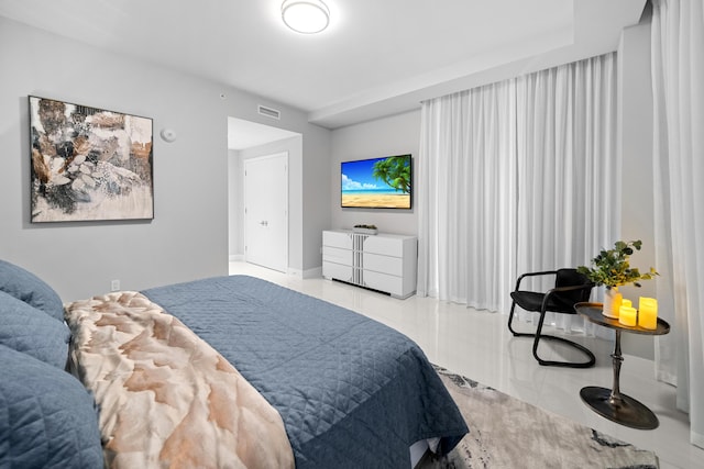 3100 N Ocean Dr Unit H-1508, Singer Island, FL 33404 - tiled bedroom with baseboards