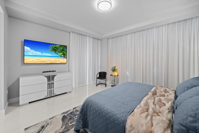 3100 N Ocean Dr Unit H-1508, Singer Island, FL 33404 - tiled bedroom featuring baseboards