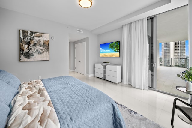 3100 N Ocean Dr Unit H-1508, Singer Island, FL 33404 - tiled bedroom featuring baseboards