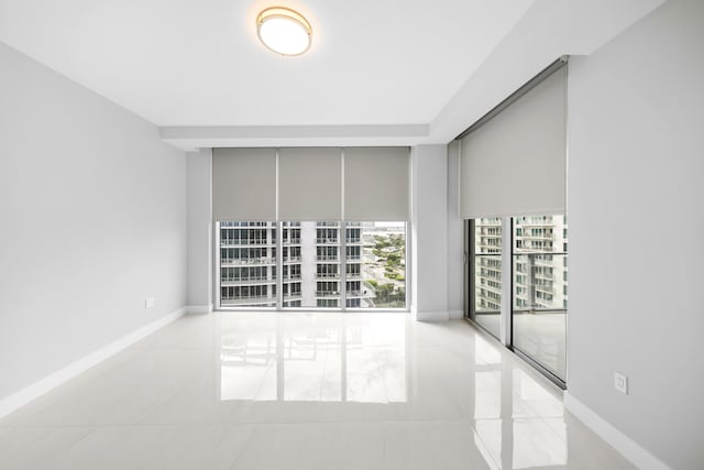 3100 N Ocean Dr Unit H-1508, Singer Island, FL 33404 - tiled empty room with baseboards