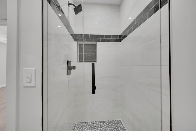 bathroom with tiled shower