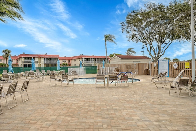 view of pool featuring a patio