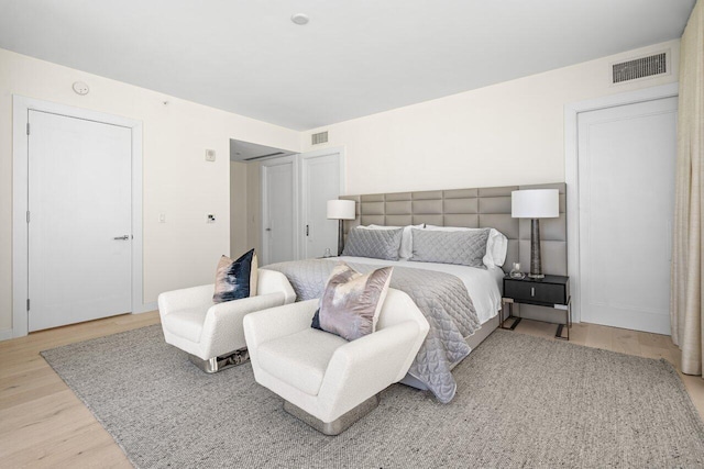 bedroom with wood-type flooring