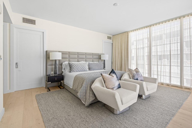 bedroom with light hardwood / wood-style floors