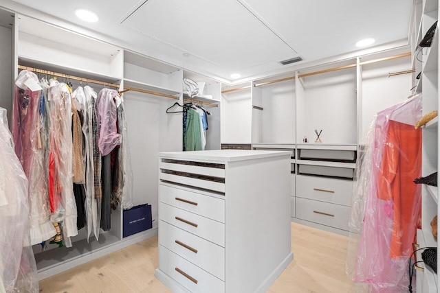 spacious closet featuring light hardwood / wood-style floors