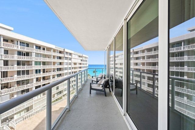 balcony featuring a water view