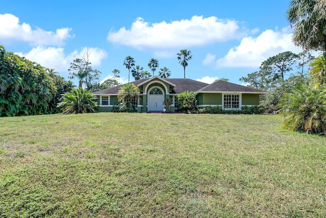 single story home featuring a front lawn and stucco siding