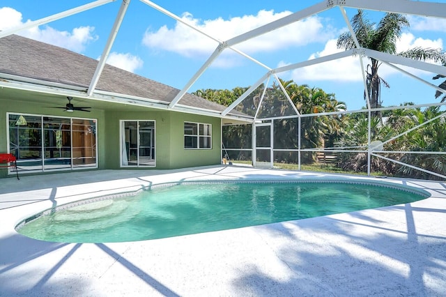 outdoor pool with a patio area and a lanai