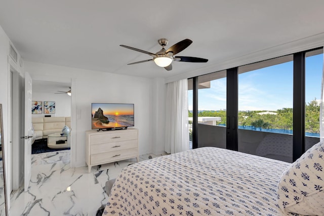 bedroom featuring ceiling fan, a wall of windows, and access to outside