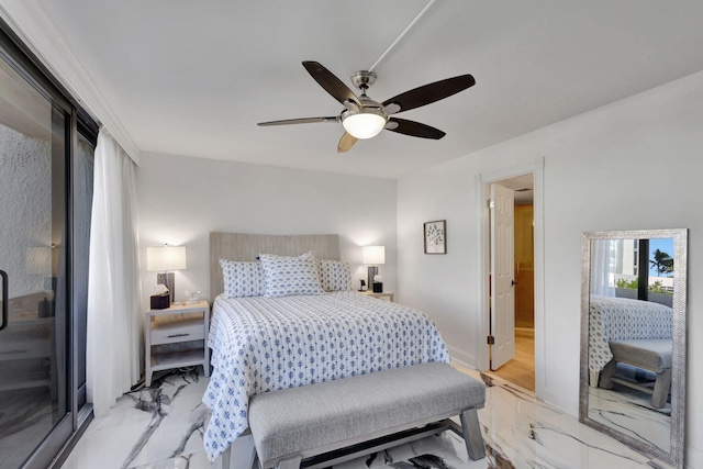 bedroom with ceiling fan and ensuite bath