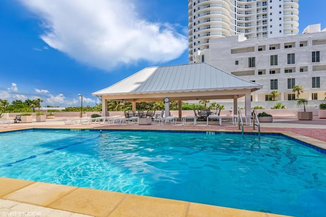 view of swimming pool featuring a gazebo and a patio area