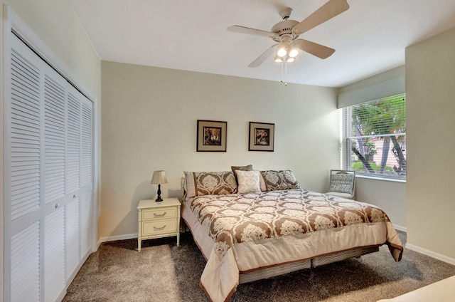 carpeted bedroom with ceiling fan and a closet