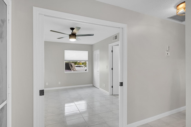 hallway featuring light tile patterned flooring