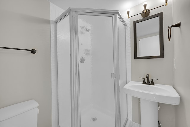 bathroom with a shower and toilet